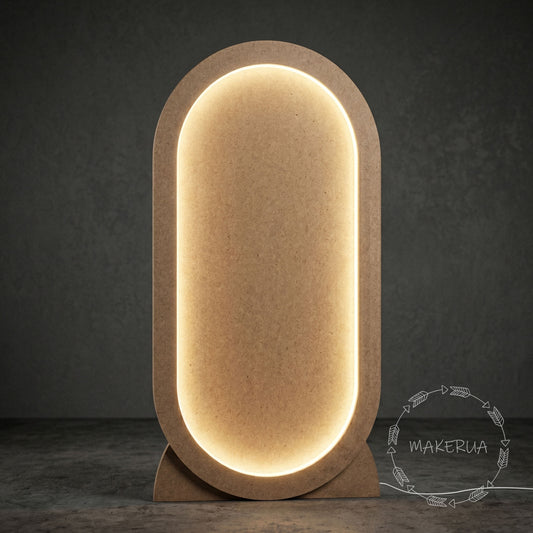 Freestanding oval MDF arch event backdrop with integrated warm LED backlighting, standing on a concrete floor.