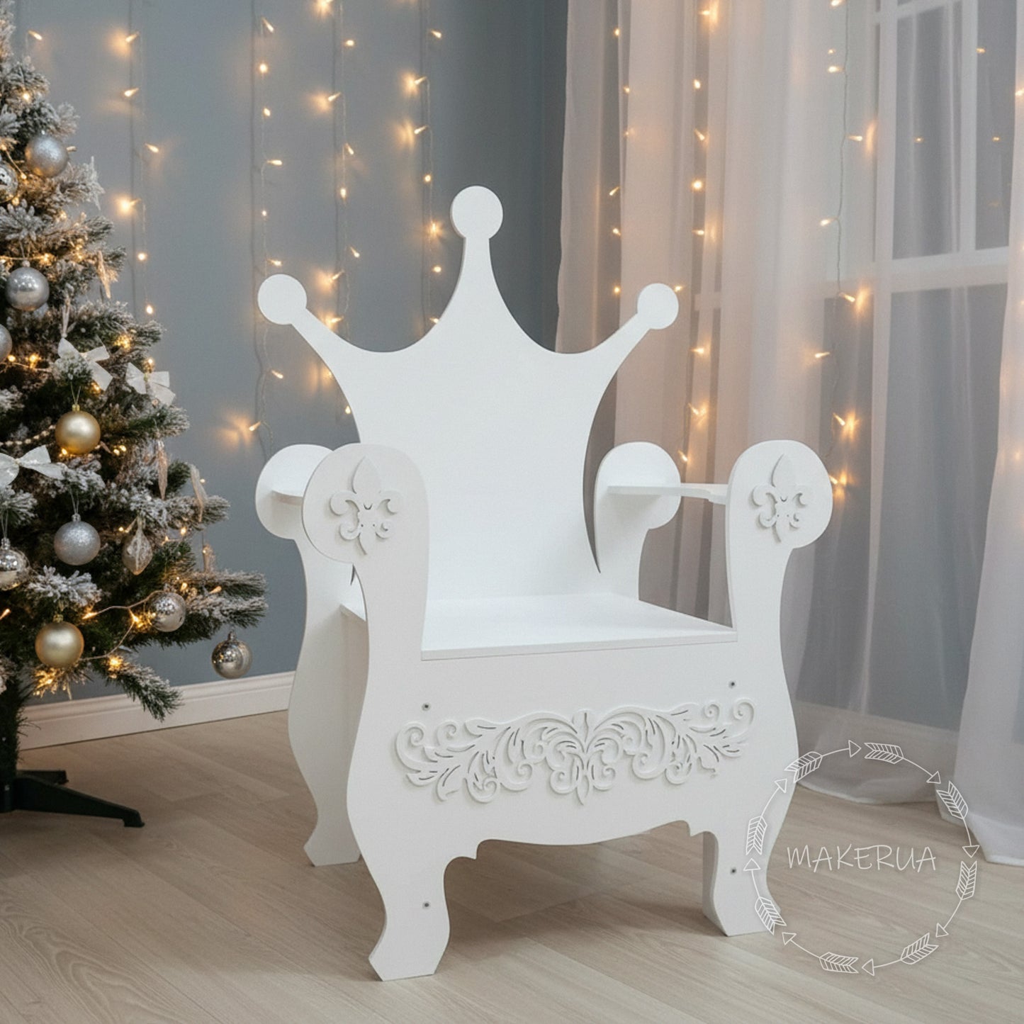White wooden event chair with a solid crown-shaped backrest and decorative swirl carvings on the front panel. Set indoors with sheer curtains and fairy lights. Premium seating prop for baby showers and royal themed birthdays.